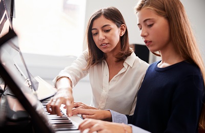 piano lesson with instructor and student